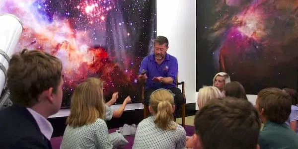  Graham Bryant and childen in a Hands On talk about
              meteorites